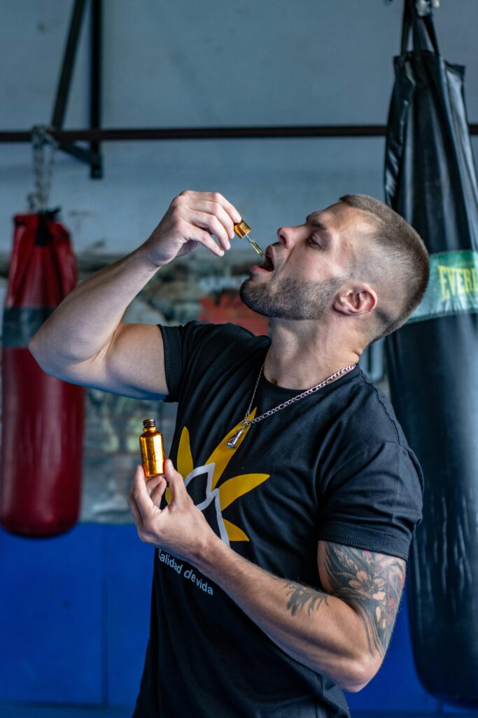 Man using a CBD tincture product